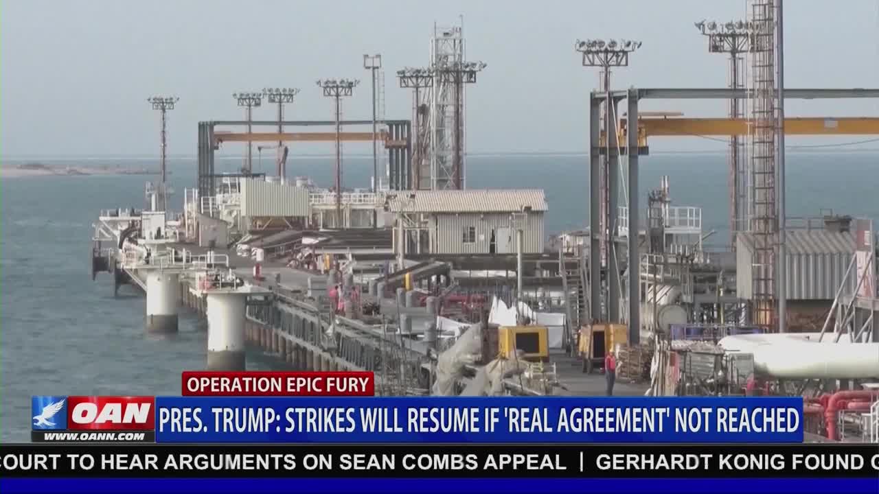 A man in a red shirt stands near a yellow generator on a sprawling industrial pier. The One America News Network chyron reports President Trump's statement that strikes will resume if a "real agreement" is not reached.