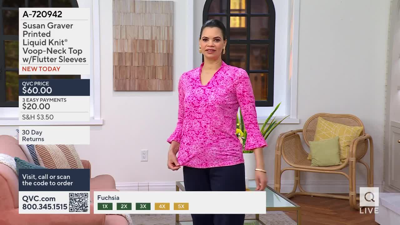 A woman stands in a bright pink top, her hands resting near her waist. The fabric of her shirt has a subtle, all-over pattern.