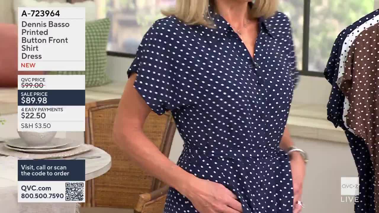 A woman in a navy polka dot dress adjusts the fabric at her waist. To her right, another dress with a similar pattern hangs on display.