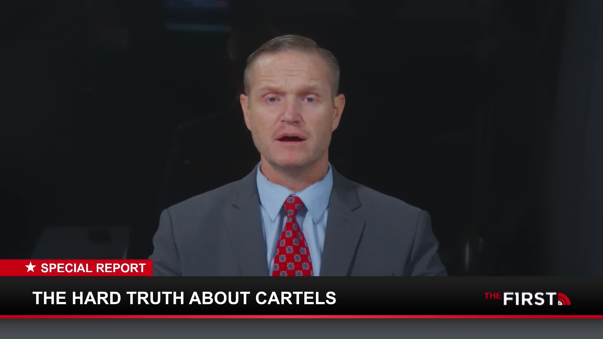 A man in a suit and tie speaks directly to the camera. A graphic overlay reads "SPECIAL REPORT THE HARD TRUTH ABOUT CARTELS" and "THE FIRST."