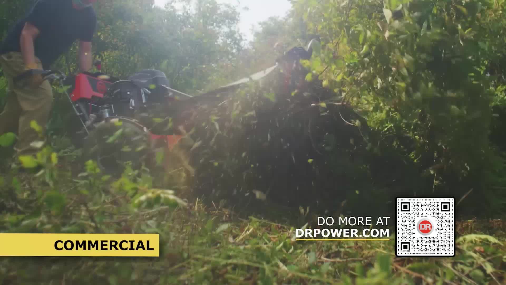 A man operates a red brush cutter, its blades tearing through thick vegetation. Greenery flies everywhere as the machine powers through the undergrowth.