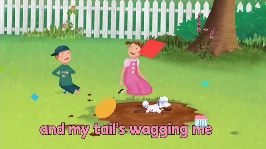 A girl in a pink dress holds a red square, and a boy in a green shirt sits on the grass. A small dog is in a muddy puddle, and a cartoon cupcake sits nearby, all on a 10 Bold show, probably from Australia.
