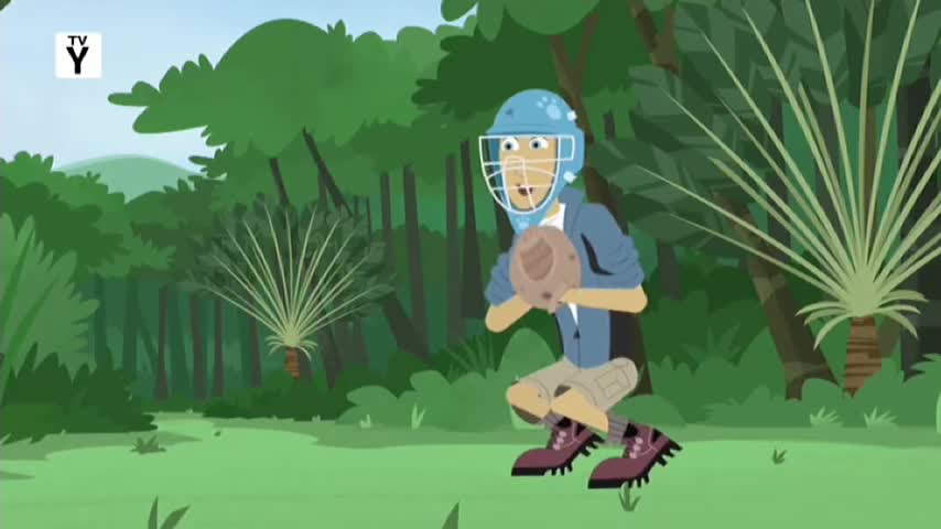 A person in a blue helmet and holding a brown ball is mid-jump, boots kicking up. The background is a lush green forest, like something from Australia, maybe on 10 Bold.
