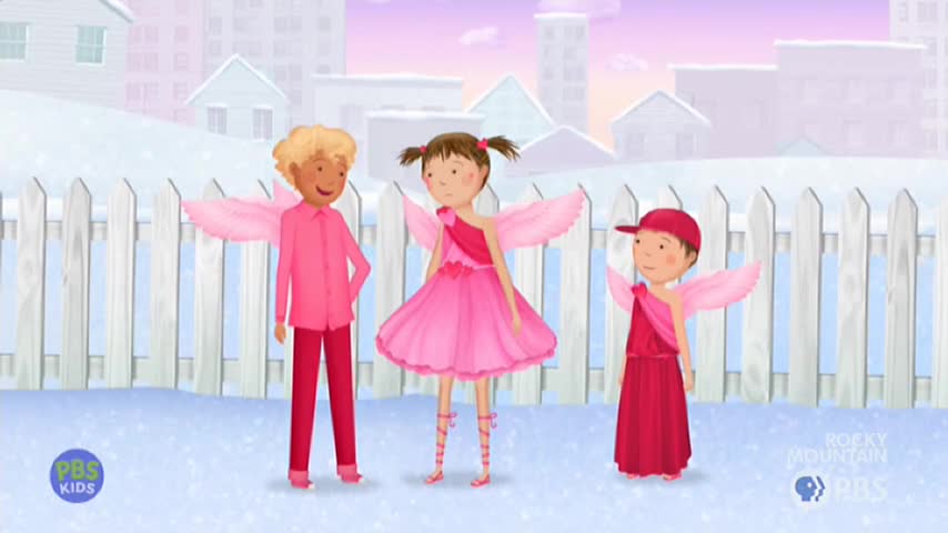 Three children in pink and red outfits with feathery wings stand in a snowy backyard. The middle child wears a frilly dress, while the other two are in pants and tunics.