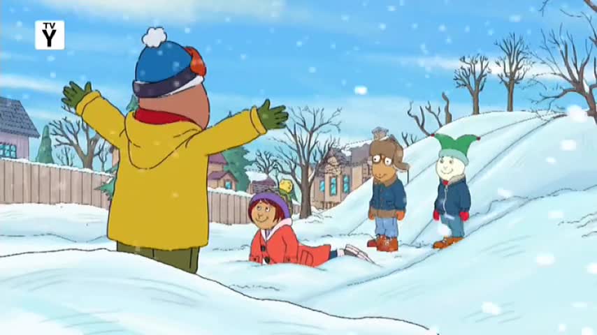A boy in a bright yellow coat stands with arms outstretched, facing away from me. Two other kids are in the snow, one on their stomach in a red coat and another standing in a blue jacket.