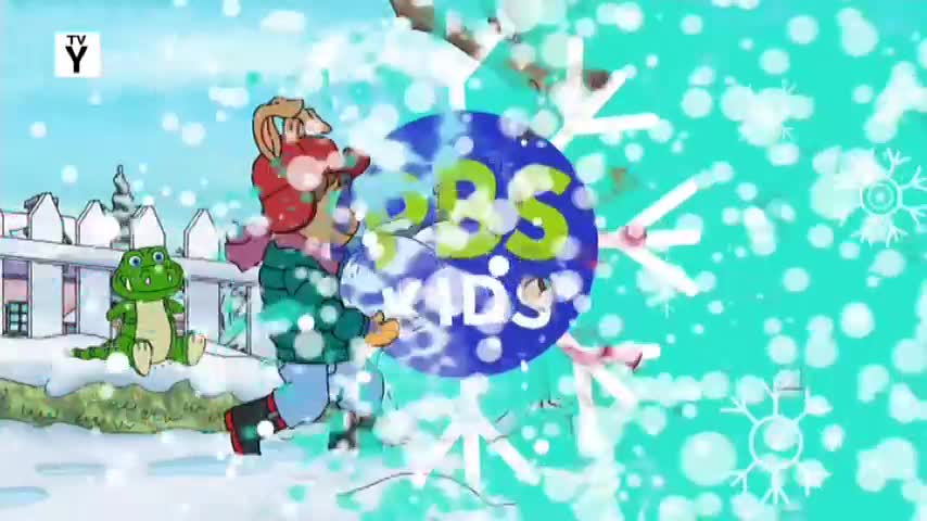 A rabbit in a red hat and green coat is running through the snow, carrying a bright blue circle with "PBS KIDS" written on it. Beside him, a green alligator sits on a snowy mound, watching the scene unfold.