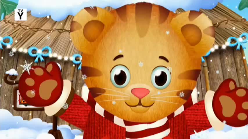 Snowflakes drift down around Daniel Tiger as he waves his red-mittened paws. He's wearing a cozy red sweater with white stripes, ready for a cold day.
