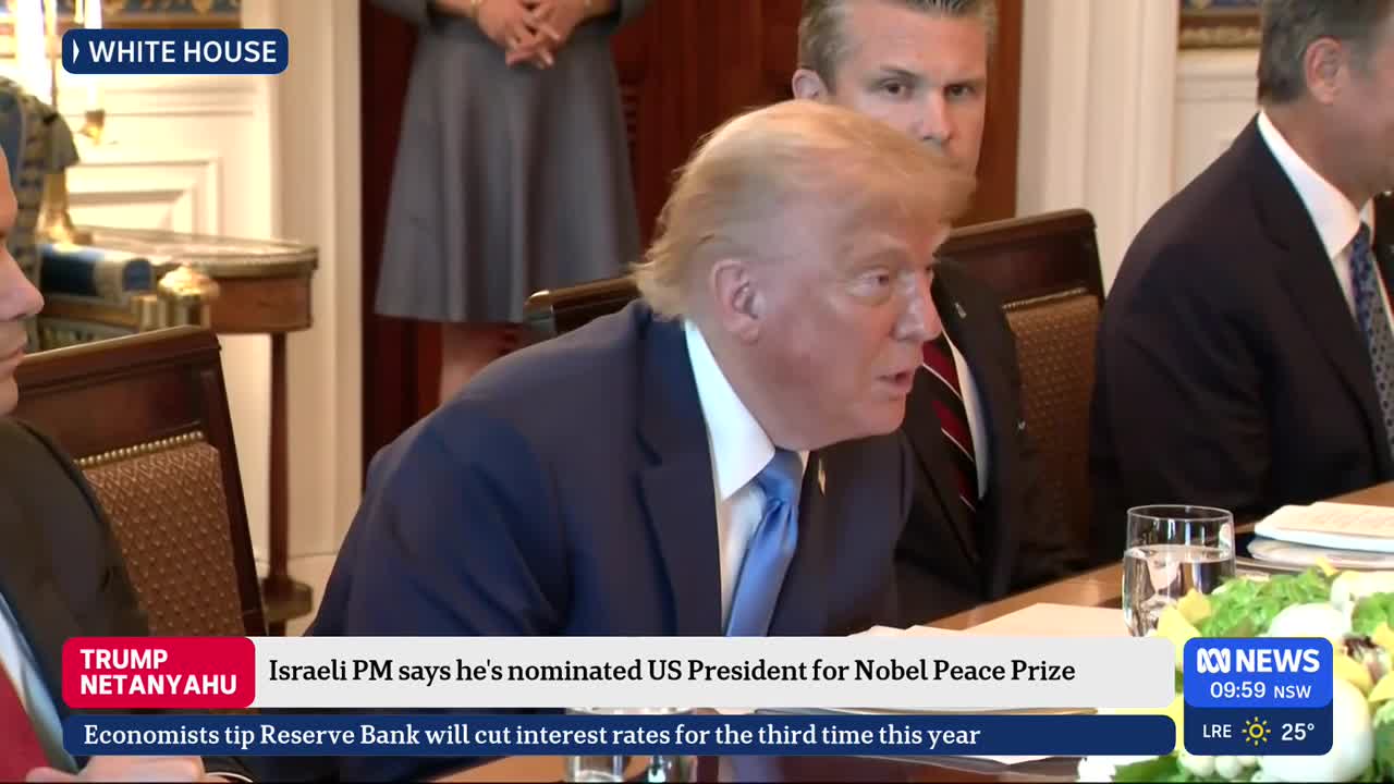 The man in the blue suit is speaking, his mouth open as he gestures slightly. The ABC News graphic in the corner reports on the Nobel Peace Prize nomination.
