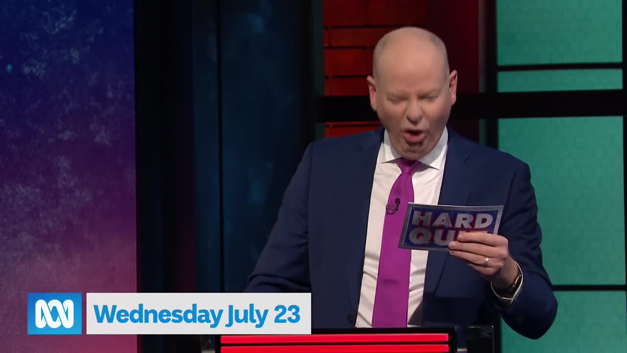 The host, in a blue suit and magenta tie, is reading from a "Hard Quiz" card, his mouth wide open. The ABC Australia logo is visible on the bottom left, with the date displayed beneath it.
