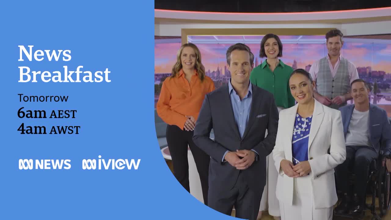 A group of people, all dressed in smart attire, are smiling at the camera in front of a backdrop. The ABC News Breakfast logo is displayed, along with the broadcast times for Australia.
