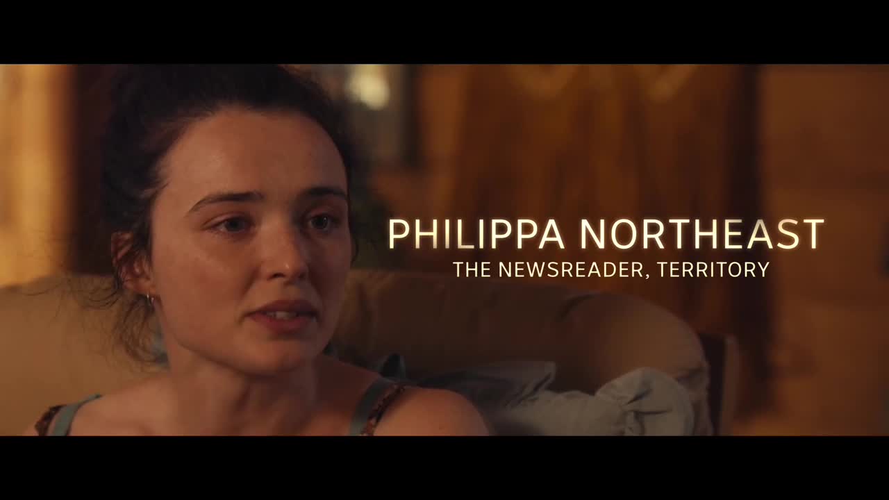 Philippa Northeast, the ABC Newsreader, is speaking, her expression serious. Her name and title are displayed in white text against a warm, blurred background.
