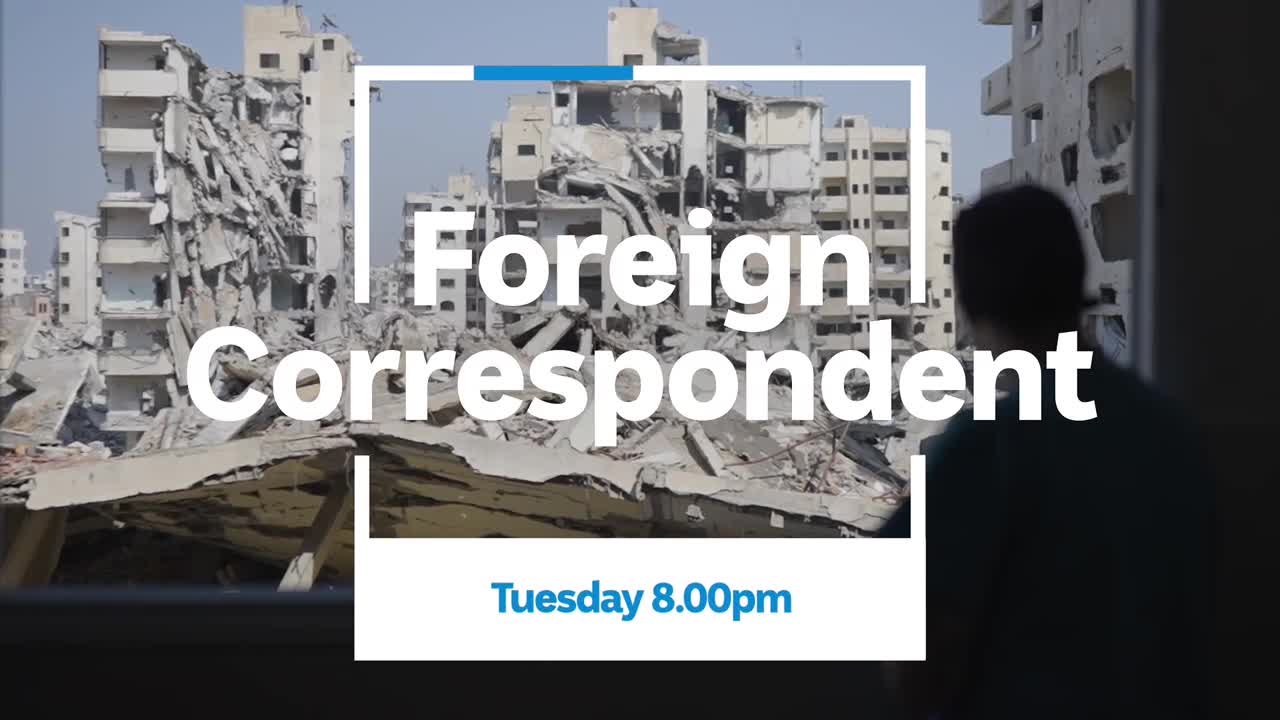 Outside, the skeletal remains of buildings stand against a pale sky. A person's back is to me as they look out at the destruction, the ABC Australia program "Foreign Correspondent" advertised on screen.
