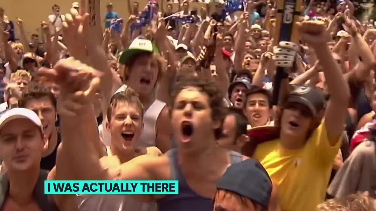 The crowd is roaring, arms raised, and Australian flags are waving. The energy is electric, and the shouts are deafening.
