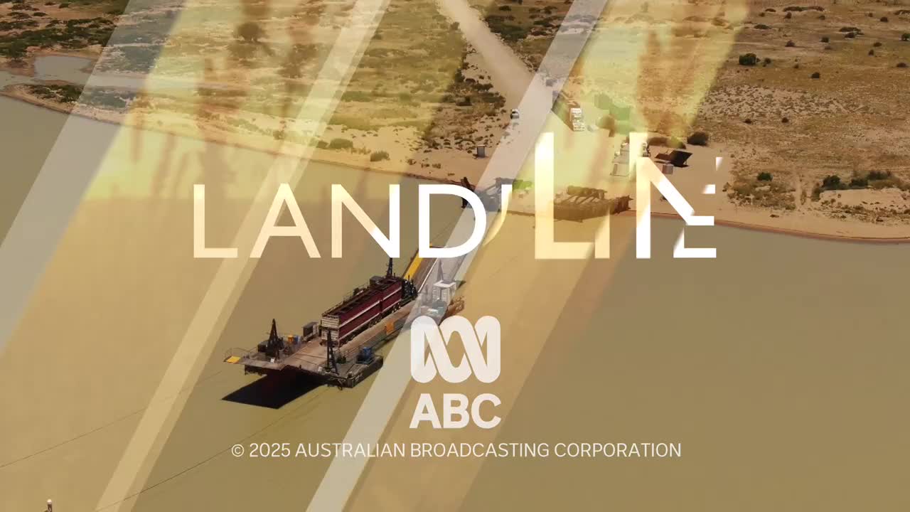 A barge, loaded with what looks like a red-topped structure, moves across the water. The ABC Australia logo and "Landline" are superimposed over the scene.

