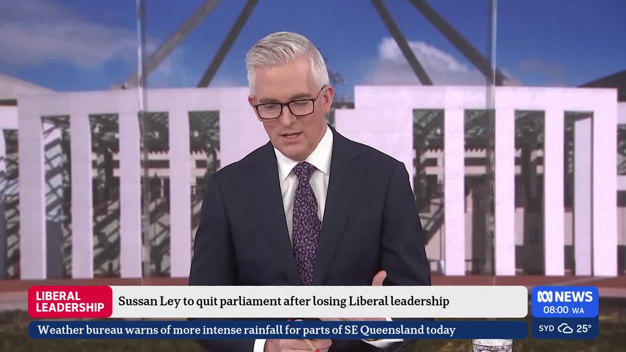 A man in a suit speaks on ABC News, with a graphic overlay announcing Sussan Ley's departure from parliament. Behind him, the Parliament House building stands under a bright sky.