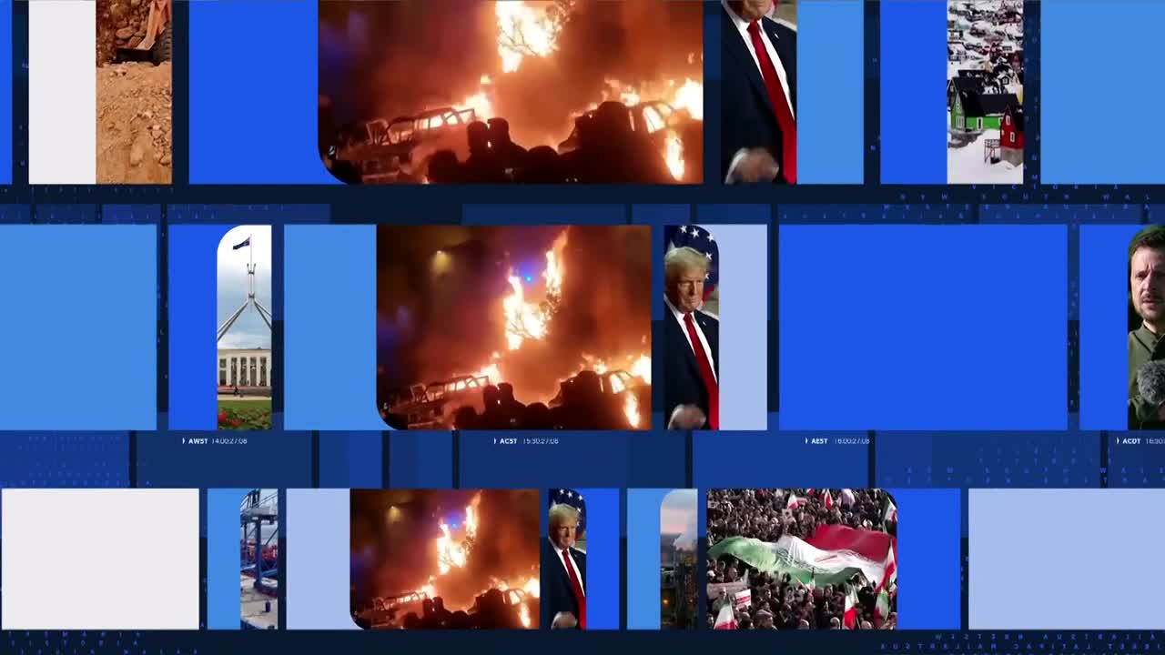 Flames engulf a line of vehicles, the heat radiating outwards. Beside it, Donald Trump stands, his red tie sharp against his suit.