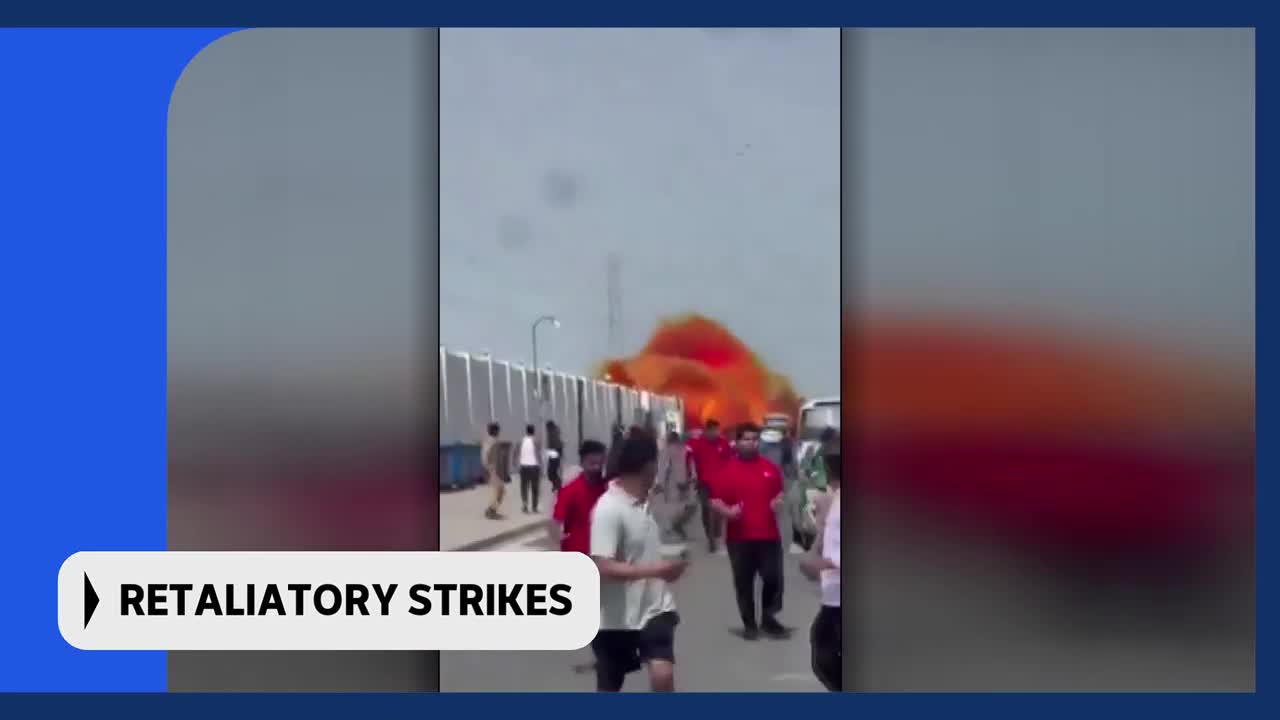 A large plume of orange smoke billows over a fence as people in red shirts gather nearby. This incident is being reported on by ABC Australia. A large plume of orange smoke billows over a fence as people in red shirts gather nearby. This incident is being reported on by ABC Australia.