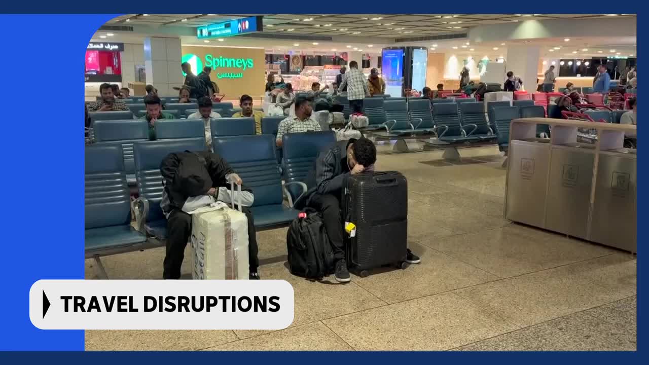 Travellers are slumped in airport seats, their luggage piled around them. The "TRAVEL DISRUPTIONS" text overlay suggests this is a scene from ABC Australia, possibly relating to a flight delay or cancellation. Travellers are slumped in airport seats, their luggage piled around them. The "TRAVEL DISRUPTIONS" text overlay suggests this is a scene from ABC Australia, possibly relating to a flight delay or cancellation.