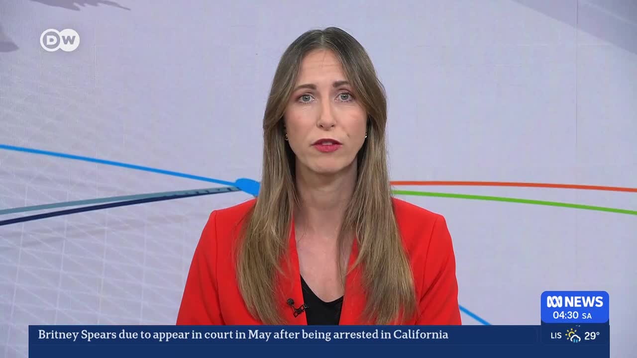 A news anchor in a bright red blazer speaks directly to the camera. The ABC News ticker scrolls across the bottom of the screen, showing the time as 04:30 SA.