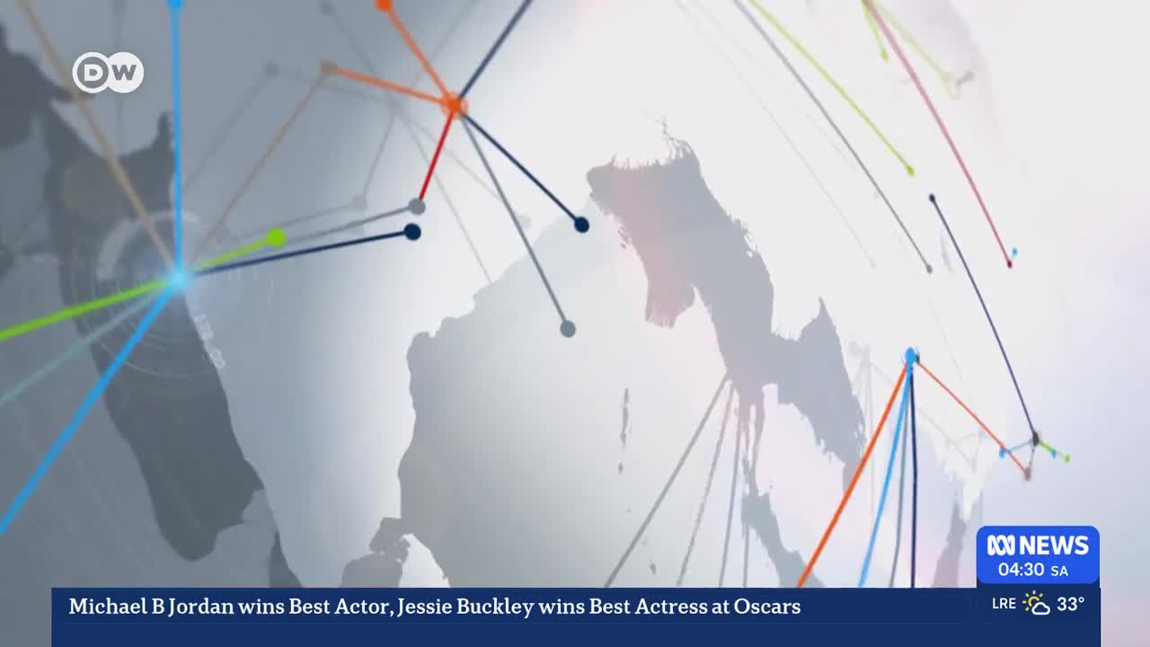 Thin, coloured lines connect dots across a faint world map. A ticker at the bottom of the screen shows ABC News details for South Australia. Thin, coloured lines connect dots across a faint world map. A ticker at the bottom of the screen shows ABC News details for South Australia.