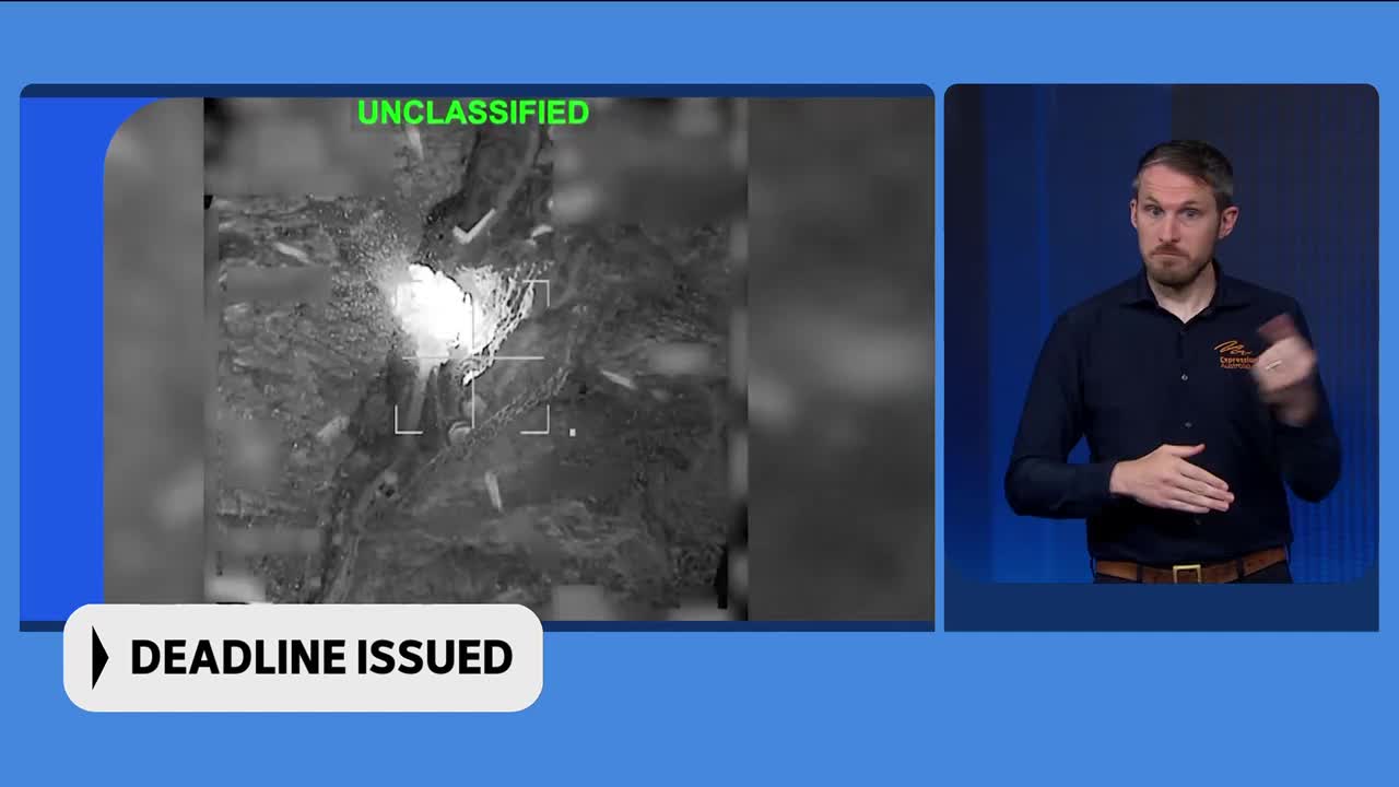 A bright, white object is illuminated in the grainy, black-and-white footage, possibly from a drone. A man in a dark shirt with an ABC Australia logo is signing on the right side of the screen.