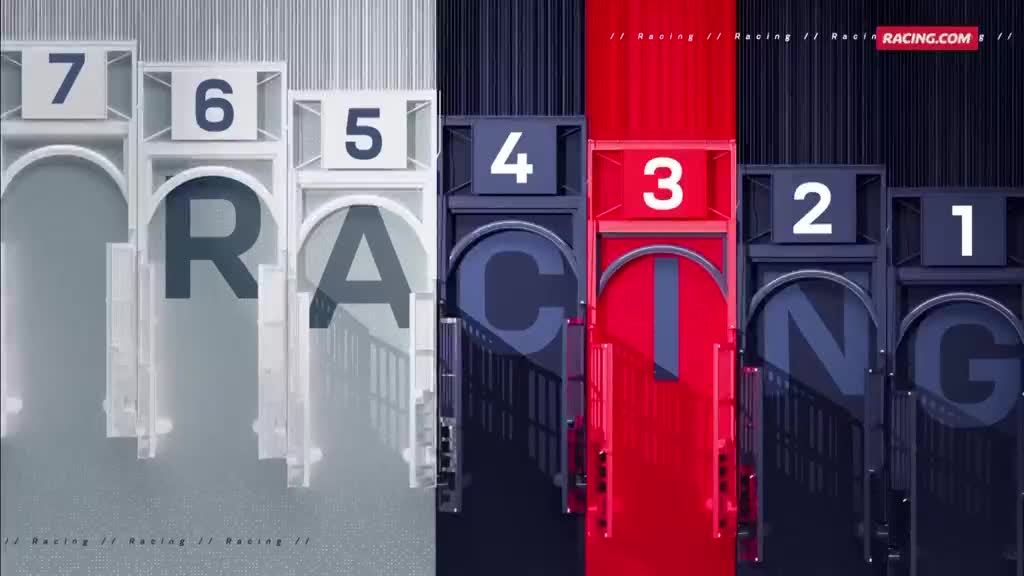 Seven starting gates, each with a number, are lined up, with the word "RACING" spelled out across them. The Racing.com logo sits at the top right.
