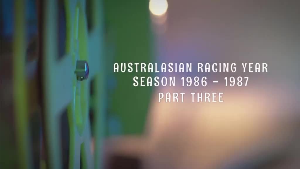 The title card for the Australasian Racing Year, Season 1986-1987, is displayed. The blurred background suggests a focus on the film reel.
