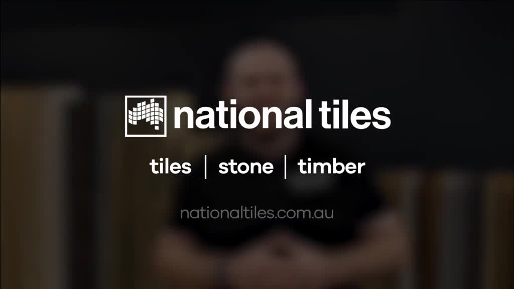 The "national tiles" logo and website address are clearly displayed. A blurred figure is in the background.
