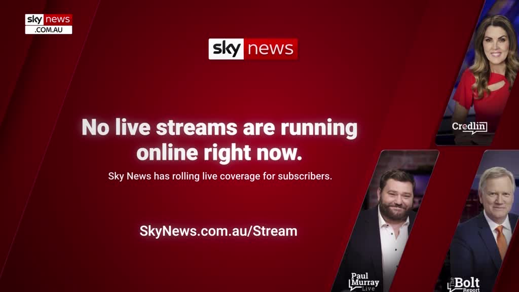 The screen is a deep red, with the Sky News logo and a message that no live streams are currently running. Below, the website address is displayed, and the faces of three presenters are visible in the corner.
The screen is a deep red, with the Sky News logo and a message that no live streams are currently running. Below, the website address is displayed, and the faces of three presenters are visible in the corner.