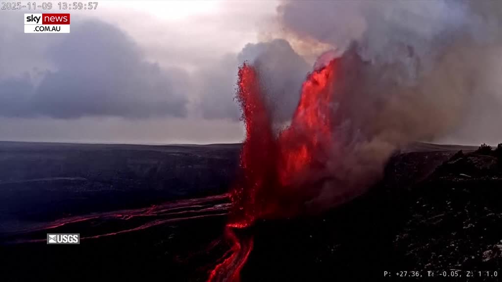 From Australia, Sky News Extra 3 is showing a volcanic eruption. Bright red lava fountains upwards, and flows down the side of the crater.
