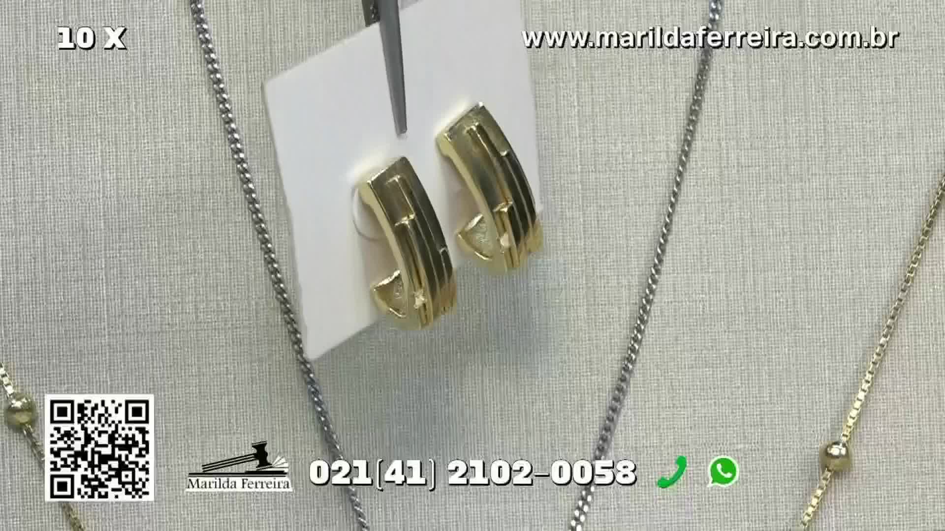 A pair of gold hoop earrings, held by a pair of tweezers, are displayed against a neutral backdrop. Silver necklaces frame the jewelry, and a phone number and website are visible at the bottom of the screen.
