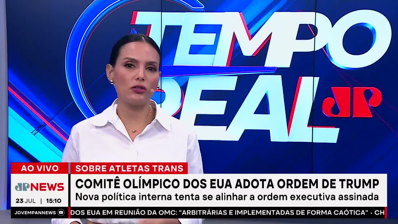 A woman in a white shirt speaks on a news set, the Jovem Pan News logo visible below. The headline, "COMITÊ OLÍMPICO DOS EUA ADOTA ORDEM DE TRUMP," is displayed on the screen.
