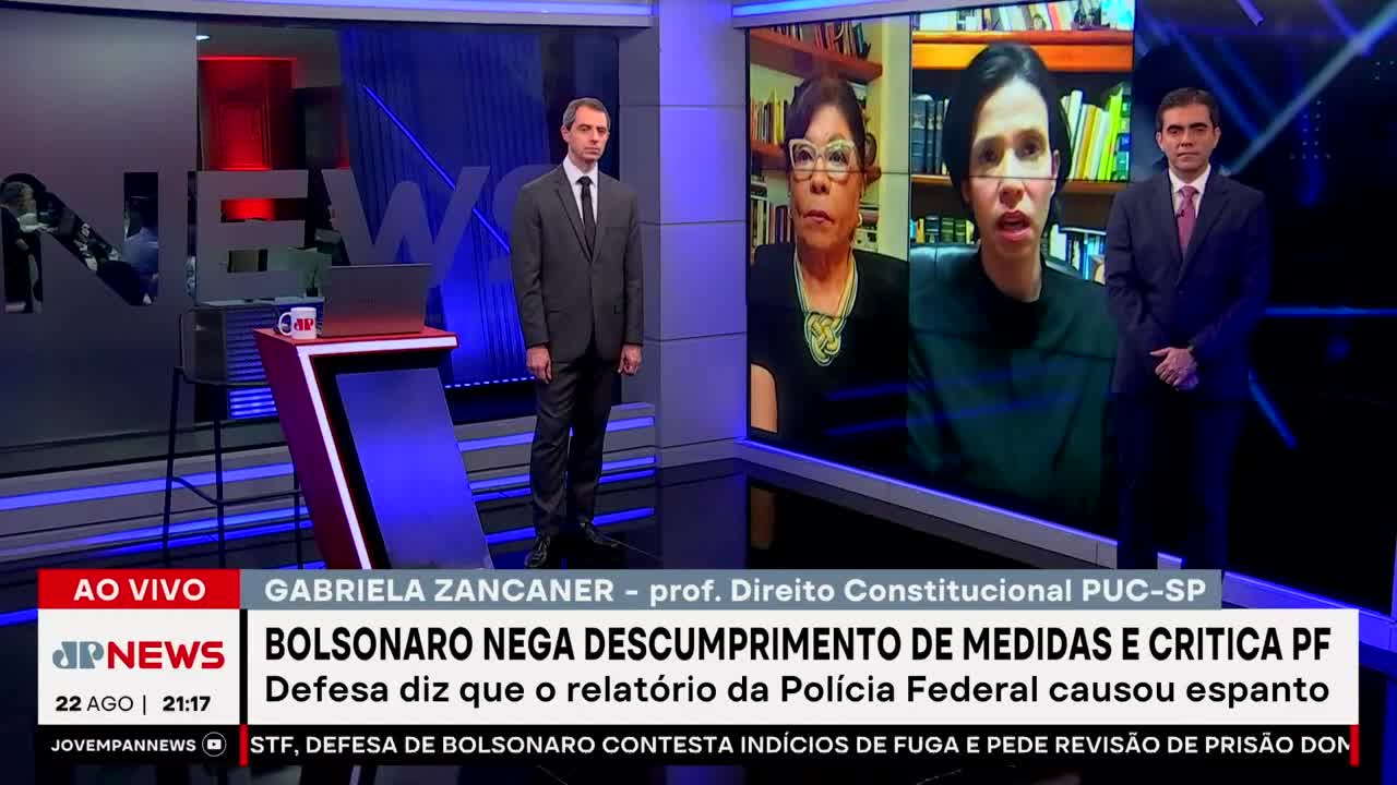 On Jovem Pan News, two men in suits stand flanking a screen displaying a woman speaking via video call. The chyron states the topic is Bolsonaro denying non-compliance with measures.
