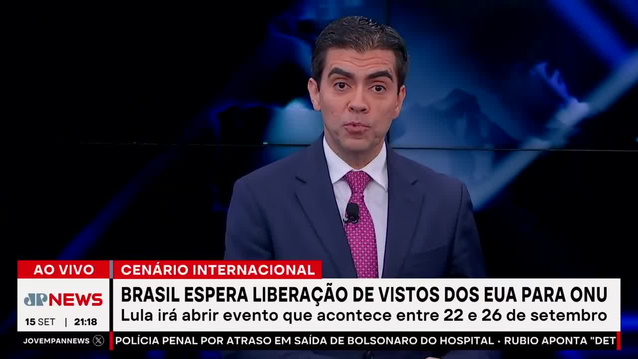 A man in a suit and tie is speaking directly to the camera, his expression serious. Below him, the Jovem Pan News banner announces Brazil's anticipation regarding US visas.
