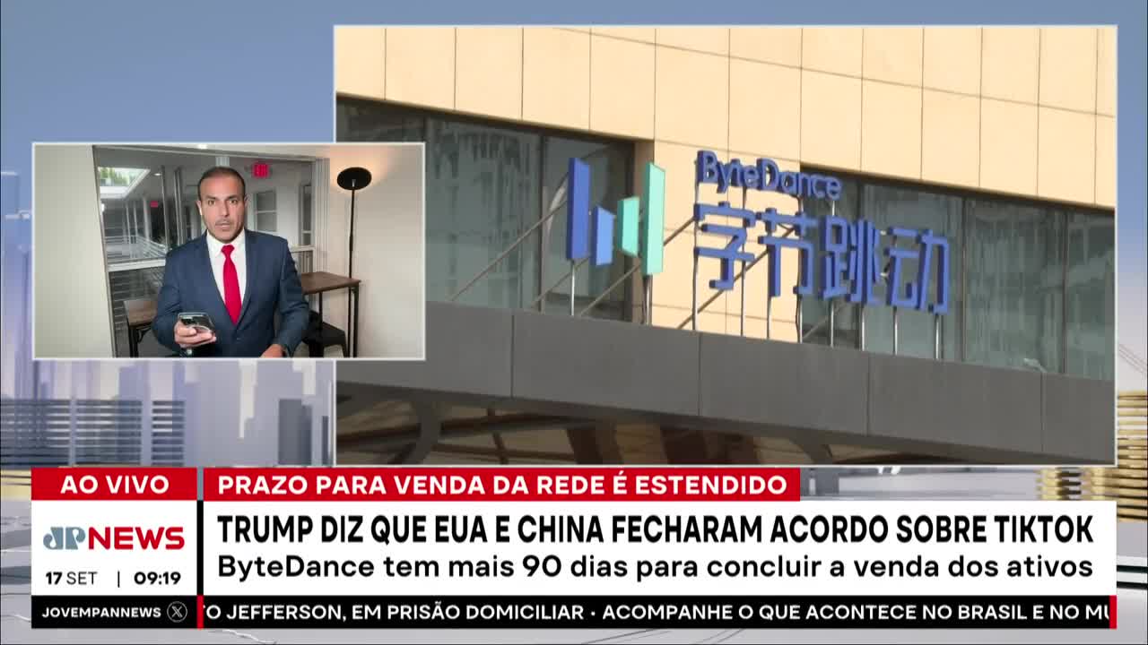 A news anchor from Jovem Pan News in Brazil, is reporting live, holding a phone. Behind him, the ByteDance logo is visible on a building, with text about a TikTok deal.
