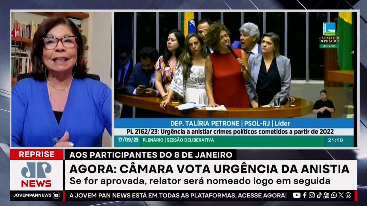 A woman in glasses speaks intently on a screen, while a group of Brazilian politicians stand behind her. The Jovem Pan News logo is at the bottom, reporting on a vote regarding amnesty.
