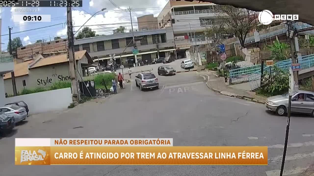 A silver car is stopped at the intersection, while a white SUV drives through. The Record News graphic at the bottom indicates a car was hit by a train for not obeying a stop sign.
