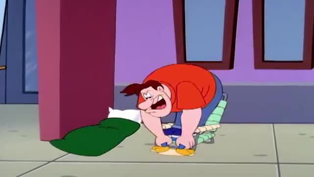 A man in a red shirt bends over, his face contorted in an exaggerated grimace. He's positioned next to a green sleeping bag and a makeshift chair.
A man in a red shirt bends over, his face contorted in an exaggerated grimace. He's positioned next to a green sleeping bag and a makeshift chair.