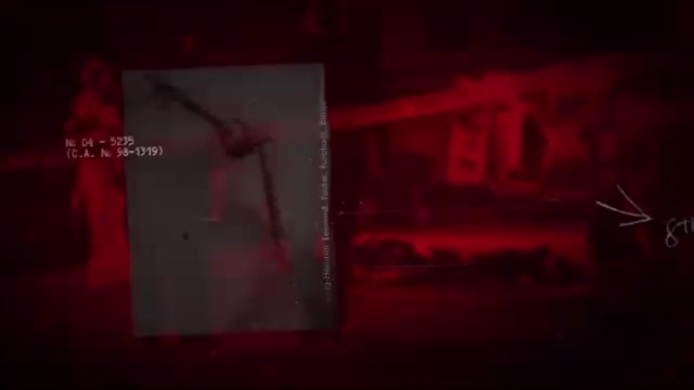 A photograph of a skeletal figure stands on a dark, red-lit background. Text on the photograph reads "N. 04 - 5235 (C.A. N. 98-1319)".