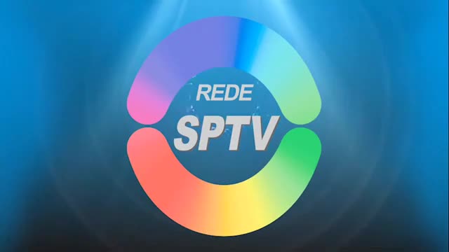 A colorful, circular logo with "REDE SPTv" in the center dominates the screen. The logo's segments transition through a spectrum of colors, from pink and orange to green and yellow, against a blue background. A colorful, circular logo with "REDE SPTv" in the center dominates the screen. The logo's segments transition through a spectrum of colors, from pink and orange to green and yellow, against a blue background.