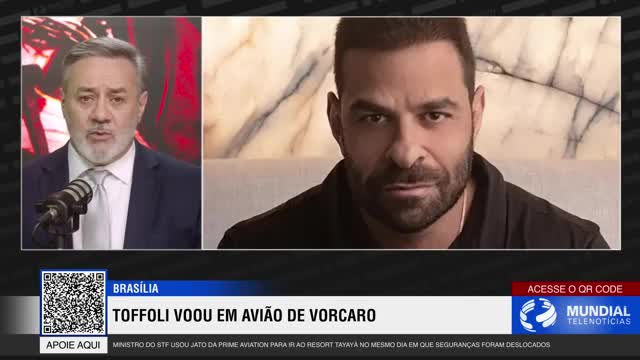A man in a suit speaks into a microphone, his expression serious. Beside him, another man with a beard looks directly at the camera. Below them, the Rede SPTV news ticker announces a story about Toffoli flying on a Vorcaro plane.