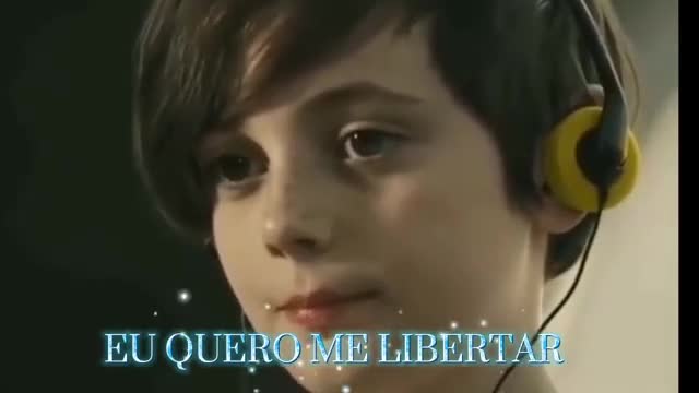 A young boy with headphones on looks intently forward, the words "EU QUERO ME LIBERTAR" glowing beneath him. This scene feels like it could be from a Rede SPTV broadcast in Brazil.