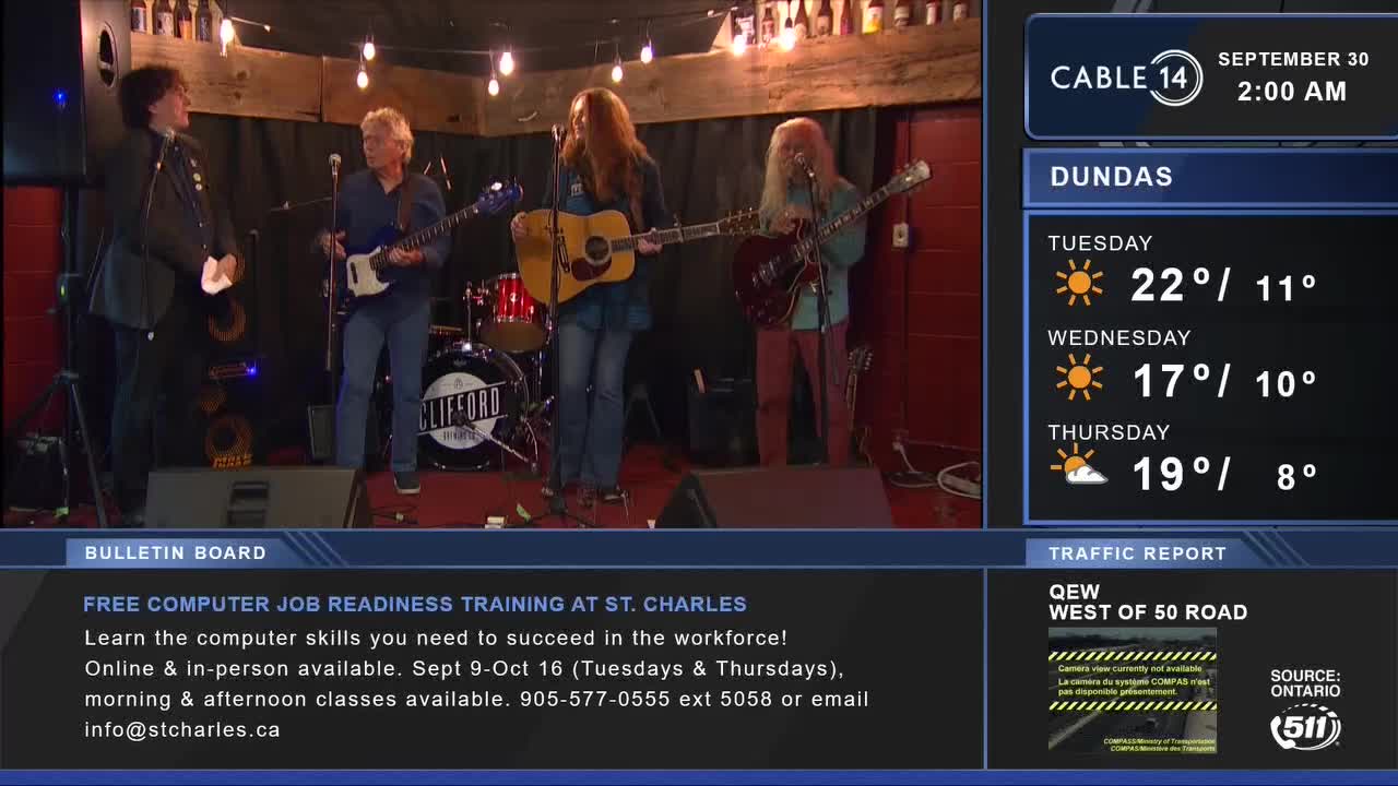 Four musicians stand on a stage, guitars in hand, ready to play. Cable 14 Hamilton is broadcasting the scene, with the weather forecast for Dundas displayed on the right.
