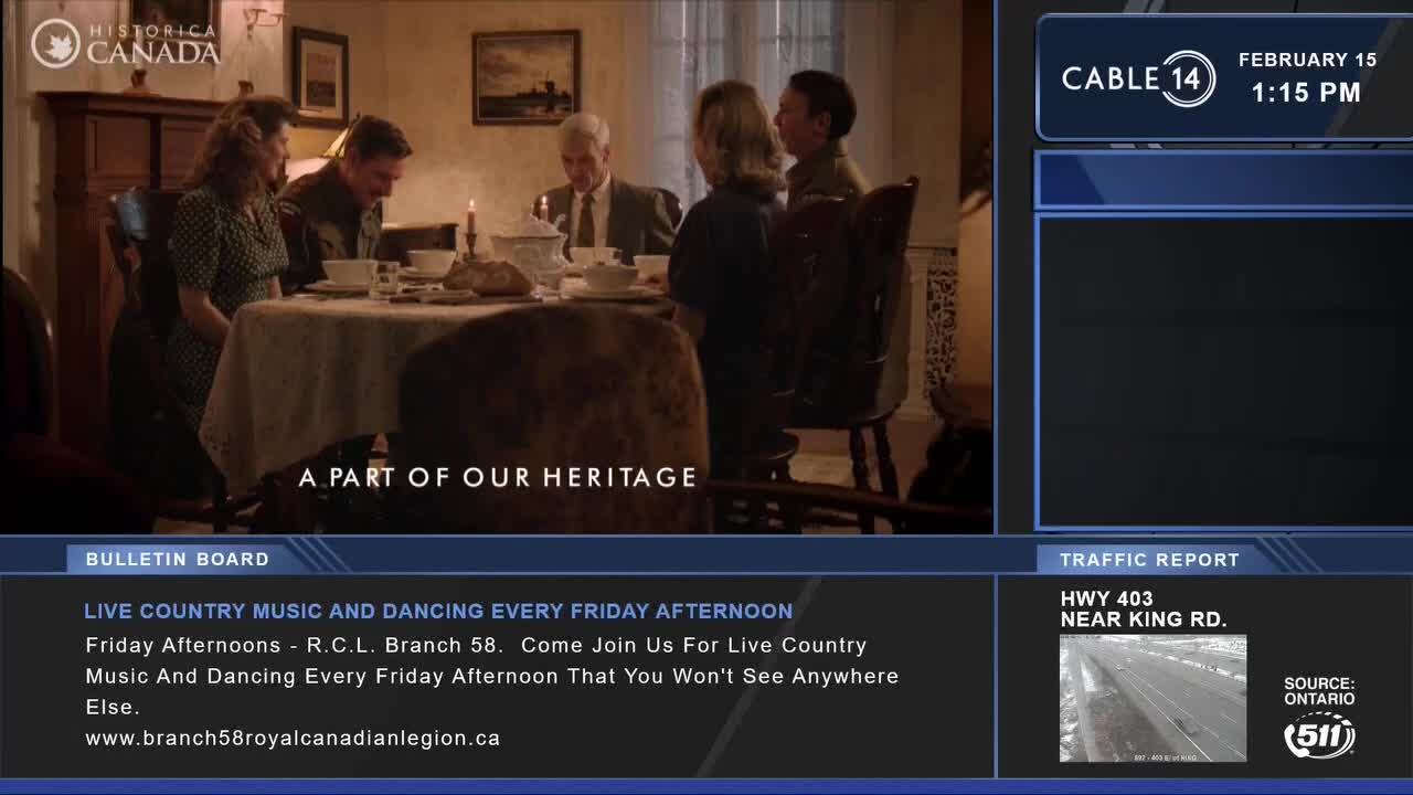 A family gathers around a table, bathed in warm light. A candle flickers as they appear to be sharing a meal.