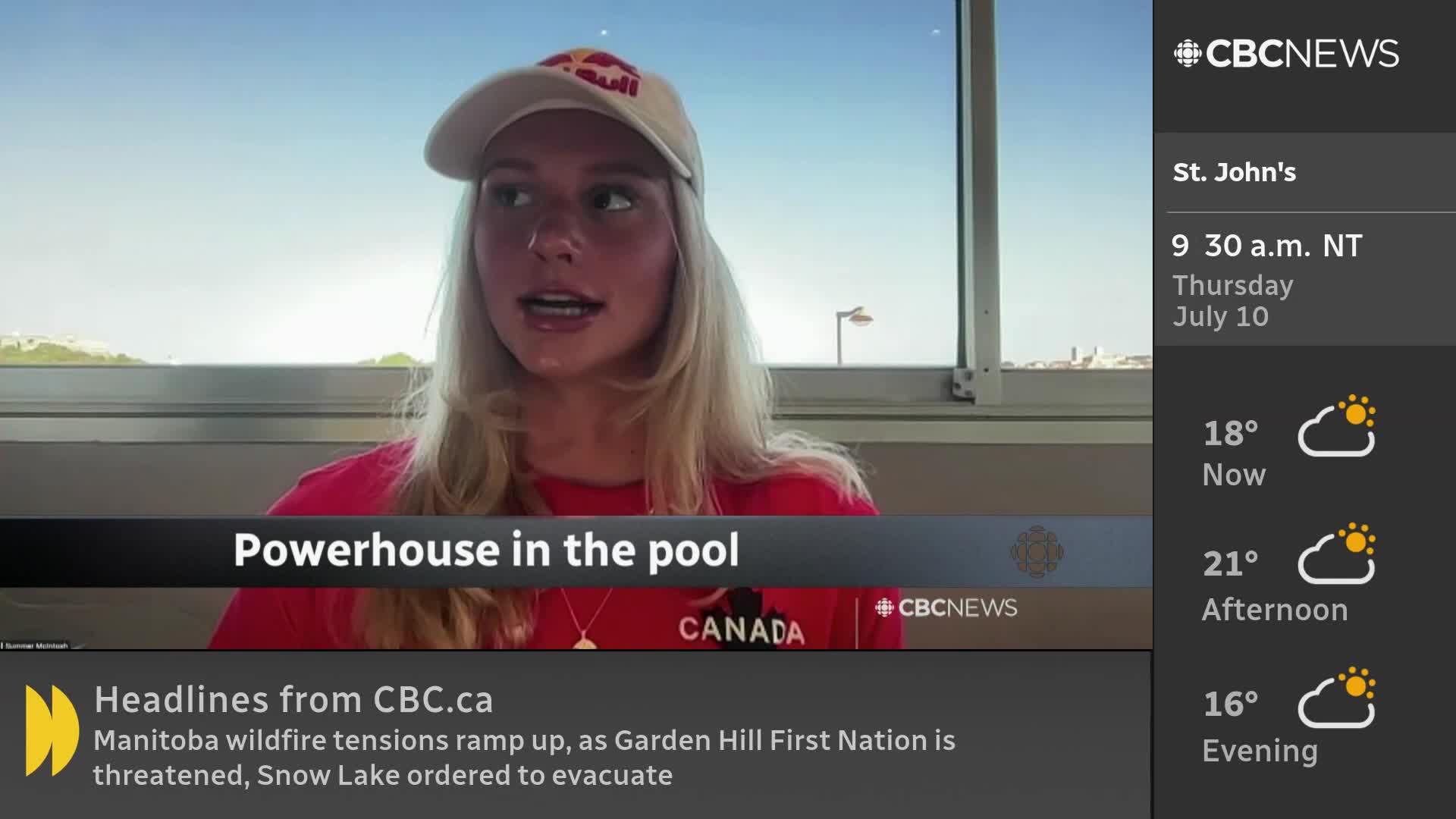 A woman wearing a Red Bull cap and shirt is speaking, framed by a CBC News Network graphic. The screen also shows the weather forecast for St. John's, Canada.
