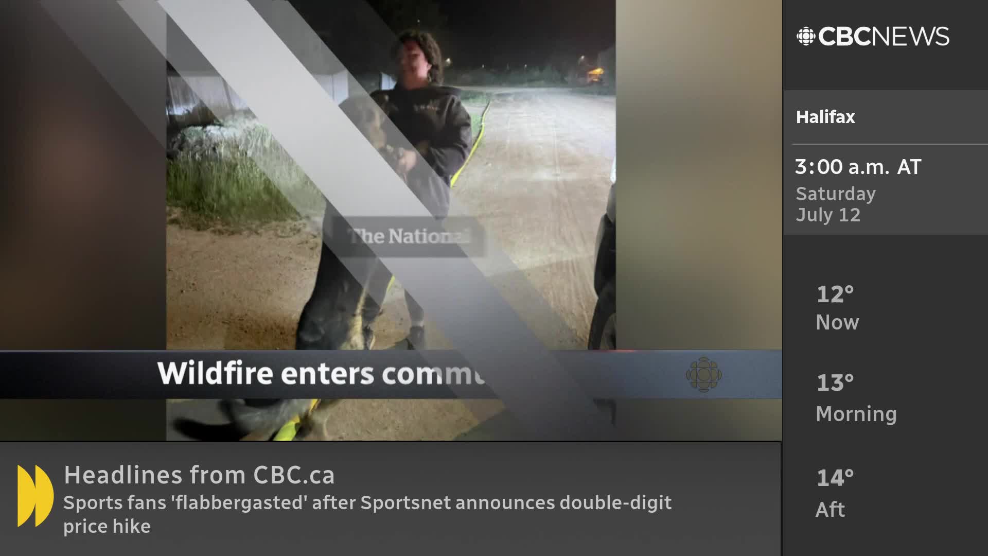 Under the bright lights, a person stands on a dirt road, with a dog at their side. The CBC News graphic reports on a wildfire entering a community.

