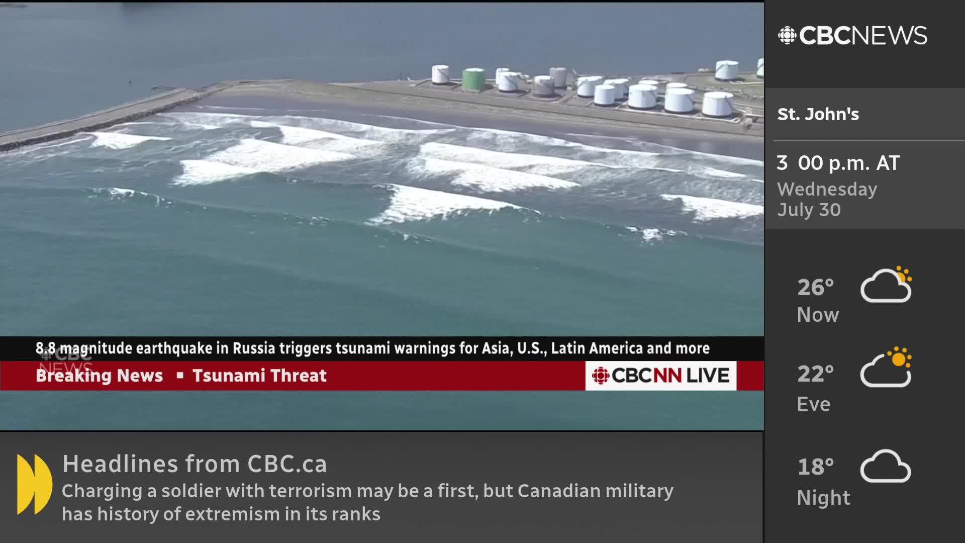 The ocean swells, cresting into whitecaps as they roll toward the shore. CBC News Network is reporting a tsunami threat, and the waves look powerful.
