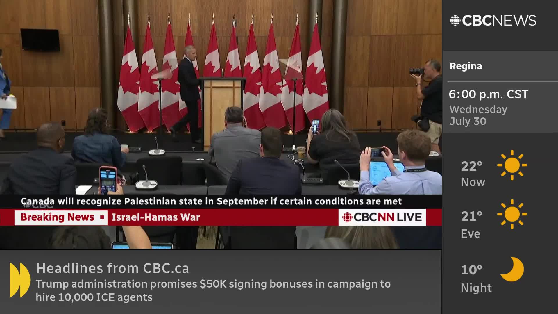 A man in a dark suit walks away from a podium, heading toward the left. Behind him, the Canadian flags stand tall, and the CBC News Network logo is visible on the screen.
