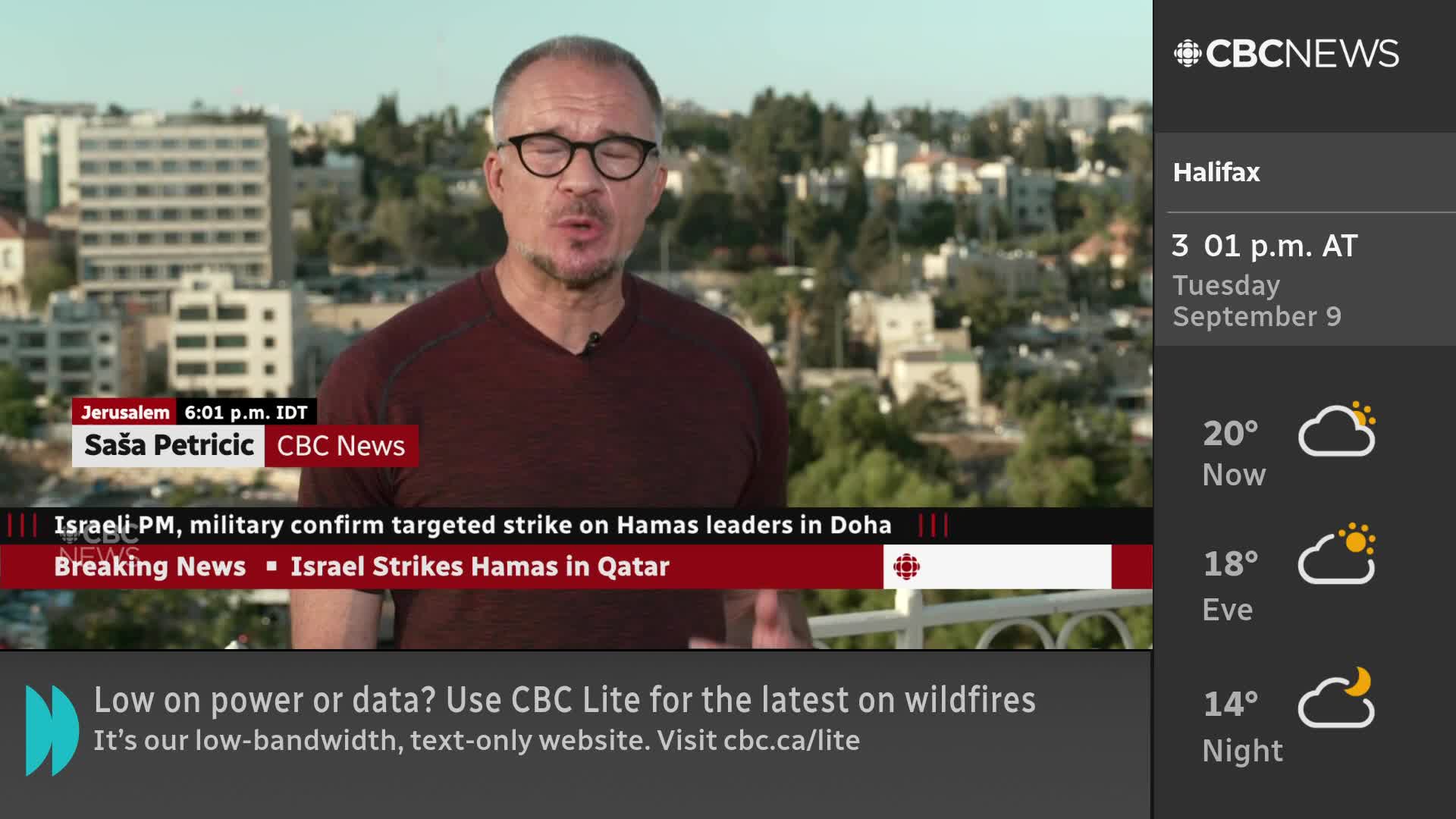 A CBC News reporter in glasses and a maroon shirt is speaking, framed against a backdrop of buildings. The lower third of the screen displays a breaking news headline about a targeted strike.
