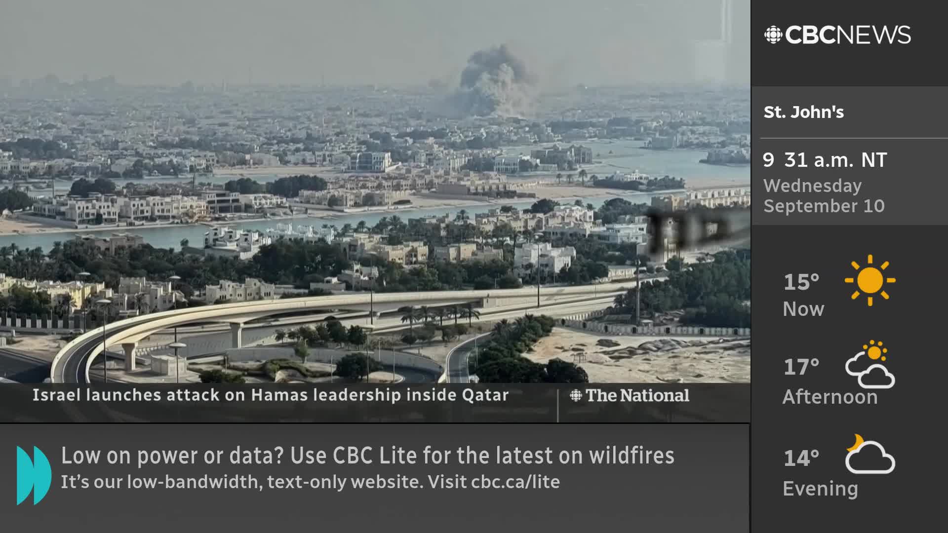 A large plume of smoke billows over a city, as reported by CBC News Network. The time in St. John's, Newfoundland, is 9:31 AM on September 10th.
